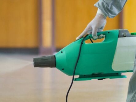 spraying machine in picture spraying no-nonscent odor eliminator spray in a room.
